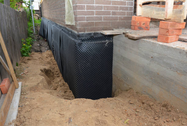 Happy homeowners after waterproofing job in Horicon